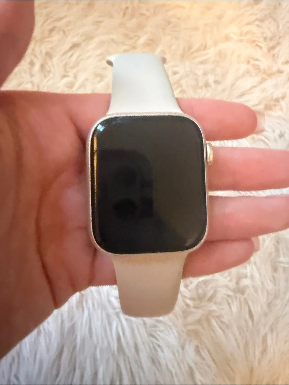 Silver Apple Watch with Light Gray Silicone Band